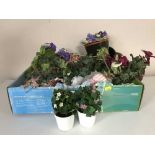 Three boxes of artificial flowers, wicker planters,