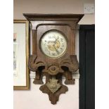 A continental mahogany wall clock