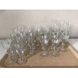 A tray of etched glass drinking glasses