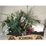 Two boxes of artificial flowers and plants
