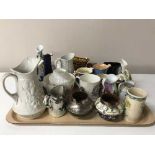 A tray containing a large quantity of late 19th/20th century pottery and china jugs,