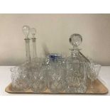 A tray of assorted lead crystal, decanters,