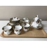 A tray containing a twenty piece Royal Albert Celebration china tea service