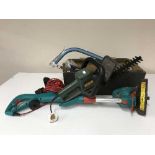 A box containing Bosch strimmer, Black and Decker electric hedge trimmer,