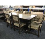 An oak refectory table and six upholstered chairs