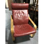 A red leather beech framed armchair