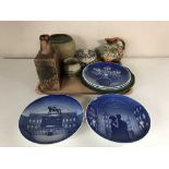 A tray of pottery vases, four Copenhagen plates,