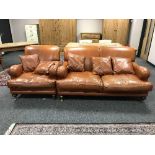 A tan leather two seater settee,