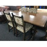 An oak refectory table and four chairs