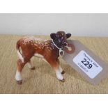 A Beswick figure - Dairy Shorthorn Calf, model 1406C, gloss.