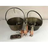 Two brass jam pans, copper twin handled pan, plated ware, brass bells,