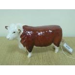 A Beswick figure - Hereford Bull, model 1363A, First Version (horns protrude from ears), gloss.