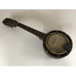 A miniature eight string banjo