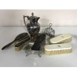 A silver and tortoiseshell part dressing table set, together with two other brushes,