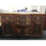 A walnut bow-fronted sideboard