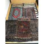 Four fringed woollen rugs