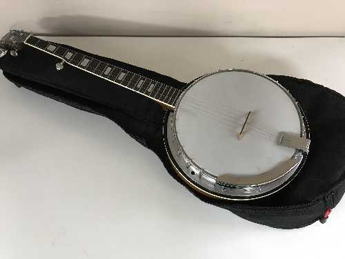 An Eagle four string banjo with carry bag