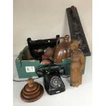 A box of wooden figures, pipe rack, Bakelite telephone, stone ware flaggon,