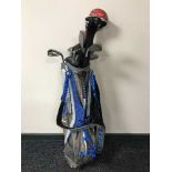 A Nike golf bag and set of Ping iron,