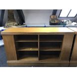 An early 20th century oak double sided library bookcase