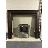 A chrome gas fire insert with marble hearth and back together with a mahogany fire surround