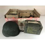 A box of military helmet and crate, small quantity of Meccano,