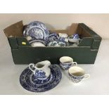 A tray and a box of 20th century blue and white china, tankards, cutlery,