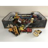 A box of heavy gauge die cast play worn vehicles