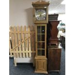 A continental oak long cased clock