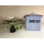 A enamelled bread bin and a set of vintage kitchen scales with weights