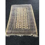 An Afghan rug on gold ground