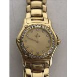 A Lady's 18ct gold Ebel wristwatch with diamond dial and bezel, 85g.