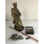 A good collection of militaria - buttons, badges, shell casing caps, swagger stick,