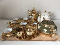 A tray of gilt lustre tea service and two Saddler teapots