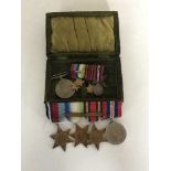 A group of four medals comprising 1939-45 Star, Atlantic Star, Burma Star and War Medal,