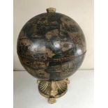 A table top globe drinks holder