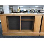 An early 20th century oak double sided library bookcase