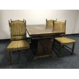 An oak refectory dining table and four chairs