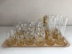 A tray of etched tinted glass ware, brandy glasses,