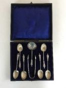 A set of six cased silver Apostle spoons, matching tongs and caddy spoon, Birmingham marks,