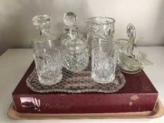 A tray of crystal champagne glasses, vases, decanters,