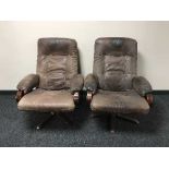 A pair of beech framed and brown leather armchairs