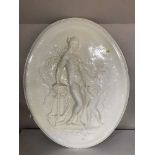 A large oval plaster plaque of a Goddess and Cherub