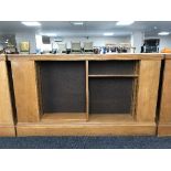 An early 20th century oak double sided library bookcase