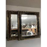 A black and gilt framed mirror and a red and gilt framed mirror (2)