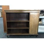 A set of mahogany open shelves fitted a cupboard