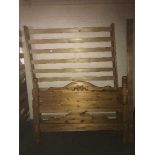 A 4'6 pine bed frame