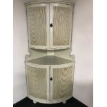 A cream double corner cabinet