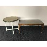 A walnut table and a painted brass topped table