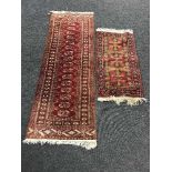 An Afghan fringed woollen runner and another rug